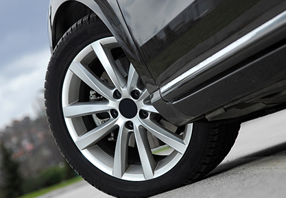 Close Up Front Left Tire On Car Close Up Front Left Tire On Car